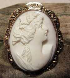 Art Deco deep relief carving Angel Skin Coral Circa 1890 10K Red Gold Brooch