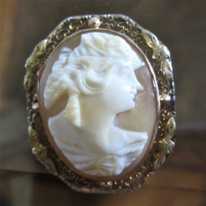 Quality Art Deco carved deep relief carnelian shell, circa 1915 Masterly crafted 10K Yellow Gold marked filigree Brooch.