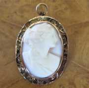 Petite quieti from 1920th high relief carved Coral stone Marked 10K Yellow Gold etched brooch/pendant