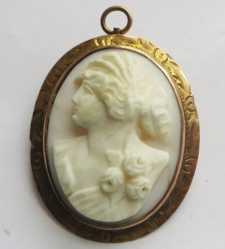 Nicely carved Coral stone Roman style woman’s head Marked 1OK Yellow Gold pendant/brooch circa 1910