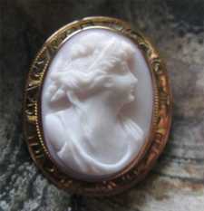 Greatly carved high relief Coral stone pretty woman’s head Marked 1OK Yellow Gold Edwardian brooch circa 1910