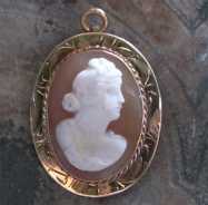 Circa 1890 Late Victorian carved carnelian shell Marked 14K Yellow Gold brooch/pendant