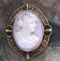 Circa 1890 Victorian Antique carved Coral image of Diana Goddess Hallmarked and tested 14K filigree Yellow Gold brooch/pendant