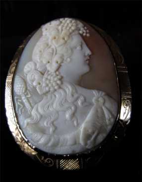 Victorian 9 kt Gold Cameo 2 1/4” tall 1 3/4” wide. Pin or pendant. Deionize or Hercules. Museum Quality