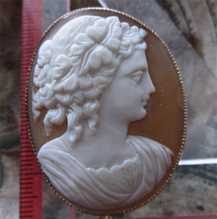 Carved image of Bacchante Antique Victoria shell circa 1880. Marked 9K Old British Rose Gold Brooch with the chain