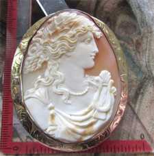 From the 1910th carved Museum Quality Classic - image of Muse Marked Huge 10K Yellow Gold Brooch/Pendant.