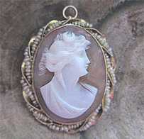 Diana, Roman goddess of Hunting - carved shell circa 1890 - 1910 Marked 10K Yellow Gold brooch/pendant with seed pearls