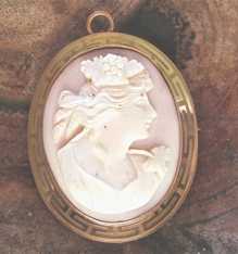 Greatly carved portrait of young woman from the 1910th - 1930th Marked 10K Yellow Gold etched Greek ornament pendant/brooch.