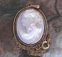Perfectly carved Coral stone - Goddess of the Soul and the wife of Eros The 1910th Pendant with the marked 14K Yellow Gold 17” chain.