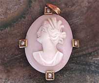 Roman goddess Ceres- hand carved Coral stone circa 1910 Marked 10K Yellow Gold brooch cameo with seed pearls