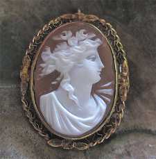 Great Art Nouveau carved shell cameo circa 1895-1920. Signed. Marked 10K Yellow Gold decorative filigree brooch/pendant