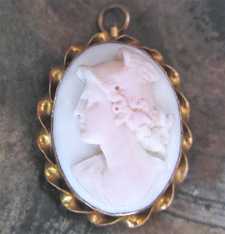High relief well carved Coral stone or Angel skin depict Mercury Marked 10K Yellow Gold 1905-1910 brooch/pendant