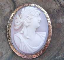 High relief carved Coral stone depict Ceres Goddess of Furtility Marked 10K Yellow Gold etched brooch from 1905-1910