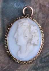 Early Victorian little Beauty Bacchante carved Angel Skin Coral stone Unmarked/tested 9 or 15 Carats Gold brooch/pendant from 1830-1860