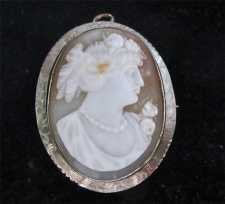 Nicely carved Art Deco shell cameo circa 1925. Signed by the Artist. Marked 10K White/Yellow Gold decorative brooch/pendant