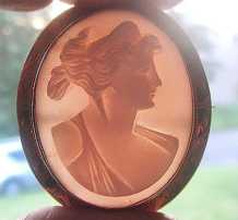 1890 - 1910 Victorian/Edwardian fine carved Coral stone Portrait. Marked 10K Yellow Gold brooch. Signed by the Artist