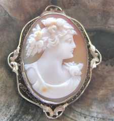 Circa 1925 greatly executed shell - portrait of girl with a flowers Hallmarked 14K White Gold filigree Brooch/Pendant.