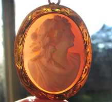 Victorian finely carved High relief Coral stone Bacchante image. Marked clasp 10K Yellow Gold brooch/pendant. 1890-1910
