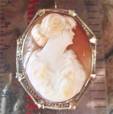 Circa 1925 greatly executed shell - portrait of girl with a fur Hallmarked 14K White Gold filigree Brooch/Pendant.