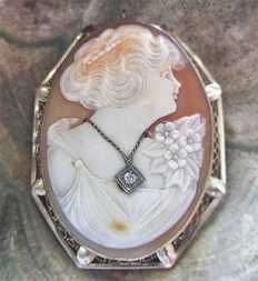 Masterly carved Art Nouveau shell with diamond brooch circa 1925 In the hallmarked filigree 14K White Gold Brooch/Pendant.