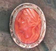 Great carved Red Salmon Coral stone high relief Ceres Goddess Marked 10K Yellow Gold circa 1910-1920 Brooch