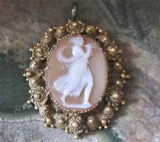 Georgian/Victorian shell circa 1820 - Athens playing the “aulos” 9Ct or higher Yellow Gold filigree pendant. Signed by the Artist