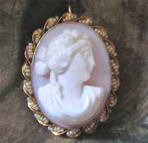 Victorian high relief girlish profile 1890-1910, carved Coral. Signed. Hallmarked 10K Yellow Gold twisted brooch/pendant with pearls