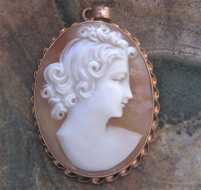 Superiorly well Carved Conch shell profile from 1930-1950 Hallmarked 10K Yellow Gold Pendant. Private collection