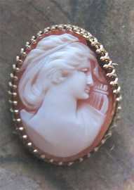 Great hand carved Vintage shell depict Muse with lira. Unmarked/Tested 10K Yellow Gold filigree brooch.