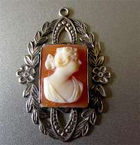 From 1910th Beautifully carved Carnelian Shell Cameo in Sterling Art Deco Filigree Pendant