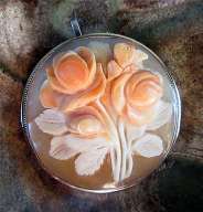 3-D & 3 colors Museum quality Carnelian Shell image of bouquet embedded in Brooch/Pendant Marked 900 Sterling bezel with Gold rope