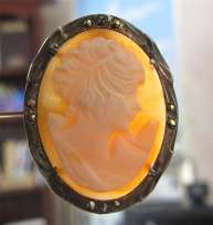 Hand carved Shell image of girl with butterfly on her shoulder in marked Silver Marquisette Pin/Pendant