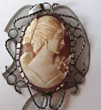 Hand carved woman portrait shell w/ hairline. Signed by The Artist. Silver Pendant