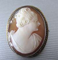 Antique shell image of Short hear girl circa 1915 900 marked Silver Pendant/Brooch