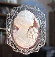 Superiorly carved Carnelian Shell Cameo with Flower Beauty Filigree Silver Bezel Brooch. Circa 1940