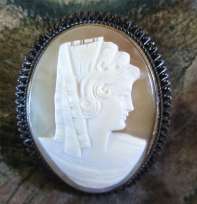 Carved Spanish Beauty shell Signed by Sculptor Unmarked darkening Silver Brooch/ Pendant.