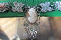 3 hand carved Sardonyx shell Necklace signed by the Artist. Circa 1940 or earlier in unmarked silver filigree Pendant