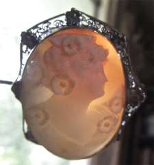 Art Deco - masterly carved Flora image light Carnelian Shell Unmarked Silver flower with Zinc cover Brooch circa 1930.