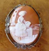 Victorian (circa 1885) Girl at the wall - village landscape scene Quality carved Carnelian shell in Filigree Coin Silver Brooch.