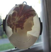 2 colors (white & red) well carved shell image of Ceres Blackened Silver Pendant circa 1935.