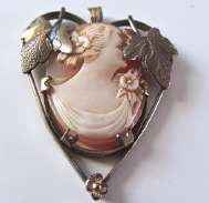 Unique “Shy Girl“ hided by silver leaves head from Carnelian shell Unmarked Vermeil Silver. Signed by the Artist