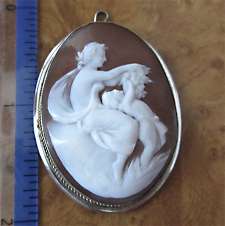 Carved Museum Quality Sardonyx shell - Venus playing with Cupid Sardonyx shell in the 800 Silver pendant circa 1915-1935. Signed