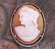 Petite hand carved Classic profile carnelian shell Unmarked Silver pendant. Circa 1910