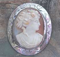 Art Nouveau hand carved conch shell portrait of Goddess Flora Marked Silver Sterling brooch. Antique circa 1910
