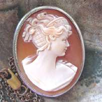 Well hand carved Classic profile carnelian shell. Signed by the Artist 800 marked Silver pendant/brooch with the chain. Circa 1930