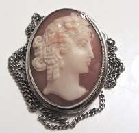 Great hand carved Bottichelli style beauty profile carnelian shell. 800 marked Silver pendant/brooch with the chain. Circa 1930