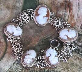 Hand carved & signed shells pretty heads from circa 1940th, marked 800 Silver Bracelet.