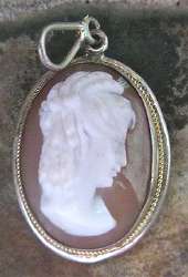 Quaint hand carved Goddess Ceres Sardonyx Signed shell cameo Marked 750(?) Coin Silver/Gold Edwardian brooch/pendant.