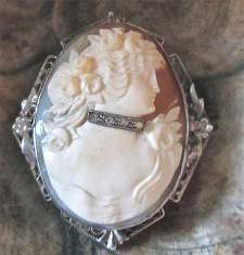 Superior carved shell Beauty with neck choker jewelry. Unmarked filigree silver brooch circa 1930.