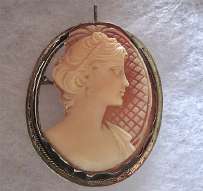 Cut out from left side hand carved carnelian shell - profile circa 1950 Marked 900 darkened Vermeil Silver/Gold pendant/brooch.